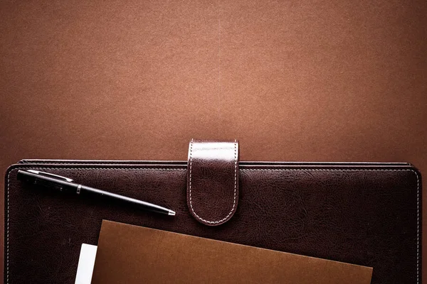 Vintage business briefcase on the office table desk, flatlay bac — Stock Photo, Image