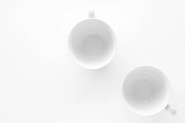 Empty cup and saucer mockup on white background, flatlay — Stock Photo, Image