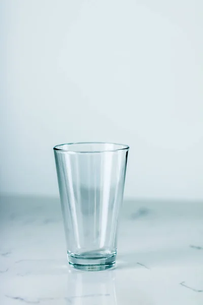 Clean empty glass on marble table — Stock Photo, Image