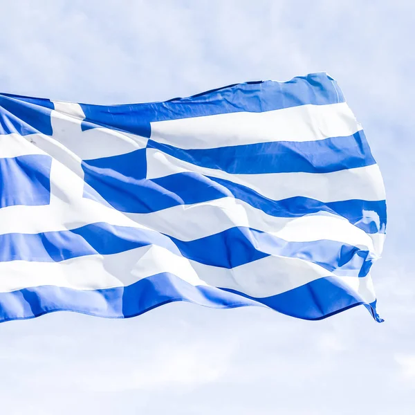 Greek flag and cloudy sky in summer day, politics of Europe — Stock Photo, Image