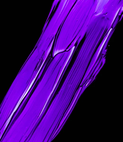 Purple neon paint brush stroke texture isolated on black backgro