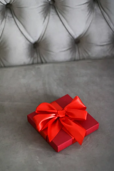 Luxury holiday red gift box with silk ribbon and bow, christmas