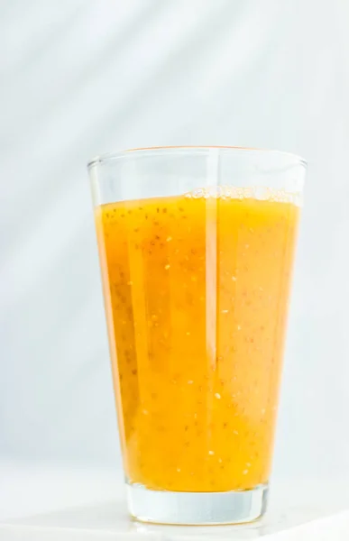 Glass of orange fruit smoothie juice with chia seeds for diet de — Stock Photo, Image