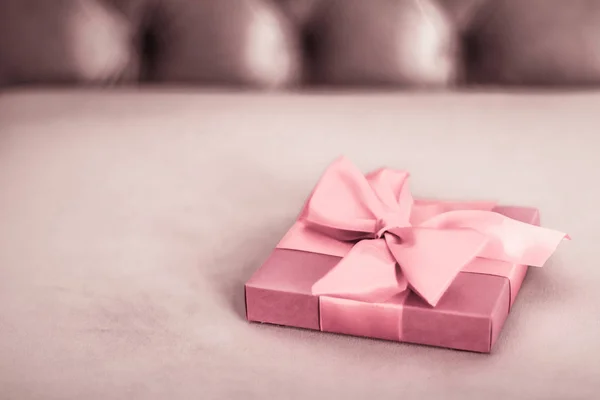 Vintage luxury holiday blush pink gift box with silk ribbon and