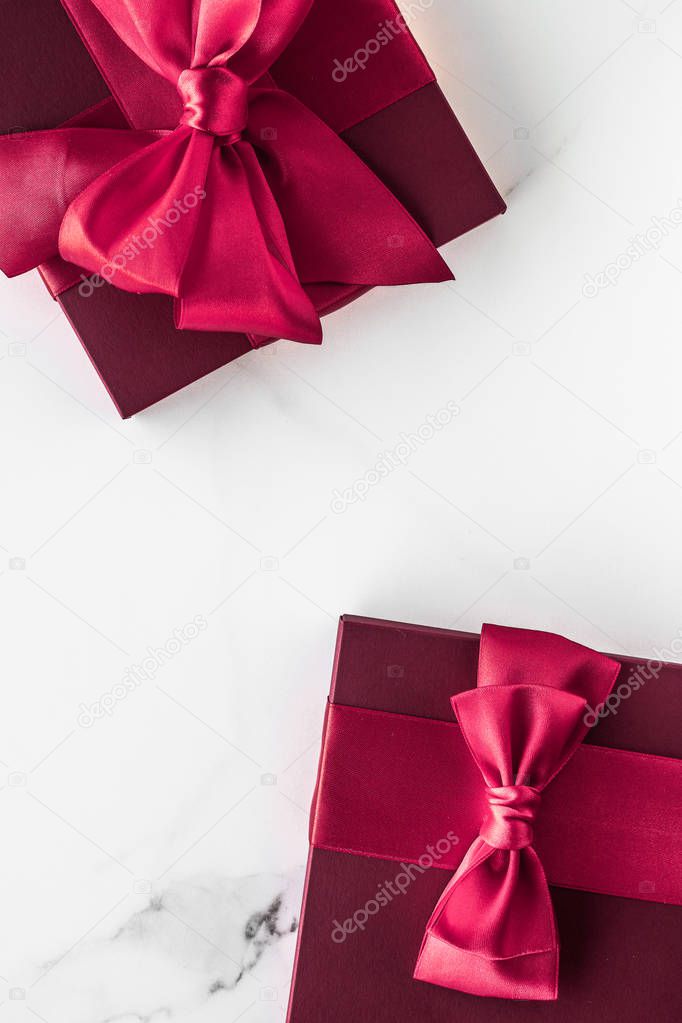 Gift boxes on marble background, holiday flatlay