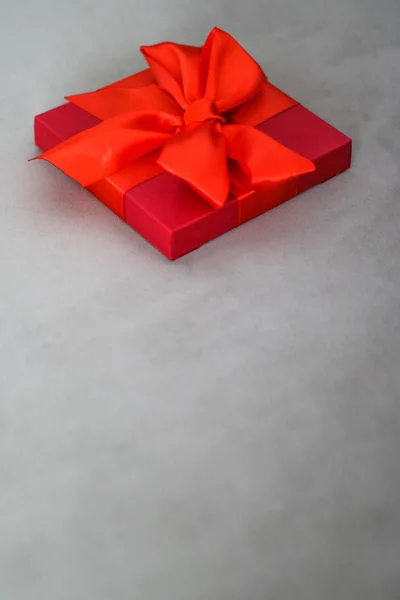 Luxury holiday red gift box with silk ribbon and bow, christmas