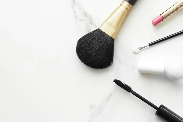 Make-up and cosmetics products on marble, flatlay background