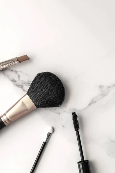 Make-up and cosmetics products on marble, flatlay background