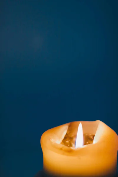 stock image Yellow holiday candle on blue background, luxury branding design