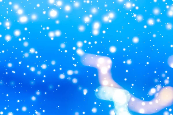 Winter holiday abstract background, glowing snow and magic spark — Stock Photo, Image