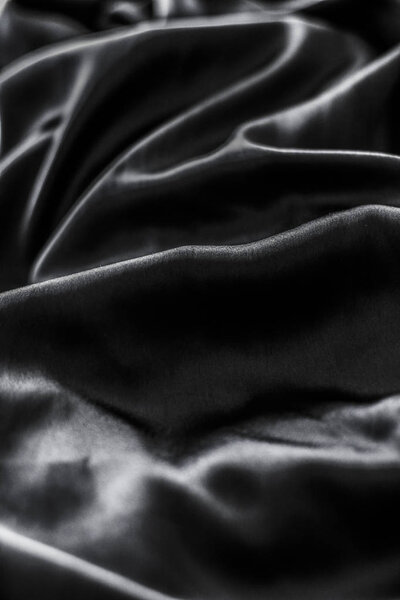 Luxury black soft silk flatlay background texture, holiday glamo