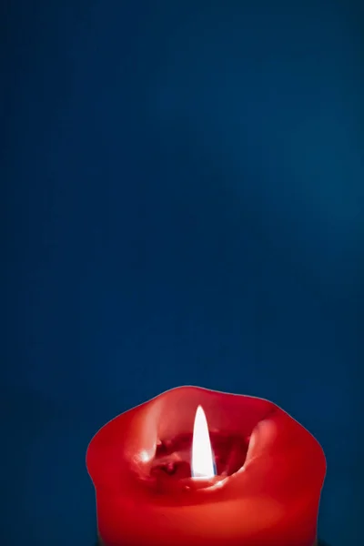 Red holiday candle on blue background, luxury branding design an — Stock Photo, Image