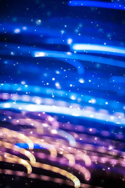 Winter holiday abstract background, glowing snow and magic spark