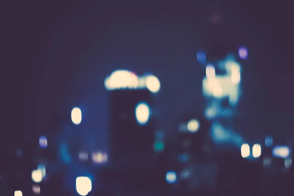 Big metropolitan city lights at night, blurry background — Stock Photo, Image