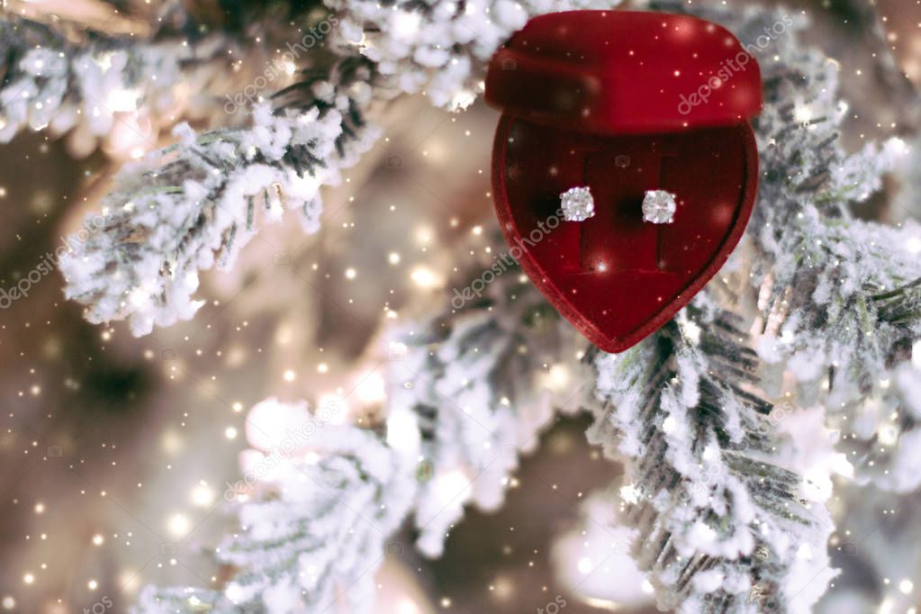 Diamond earrings in heart shaped jewellery gift box on Christmas