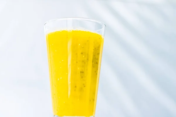 Glass of yellow fruit smoothie juice with chia seeds for diet de — Stock Photo, Image