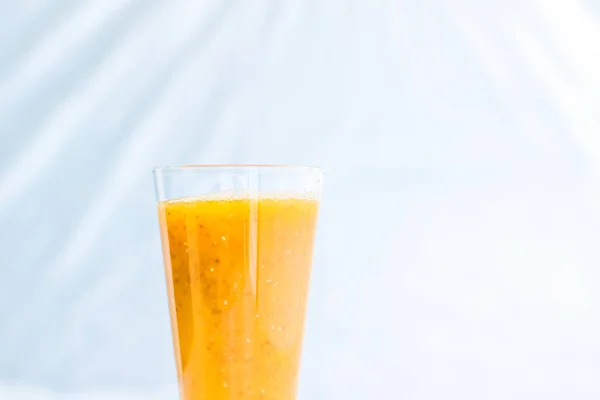 Glass of orange fruit smoothie juice with chia seeds for diet de — Stock Photo, Image