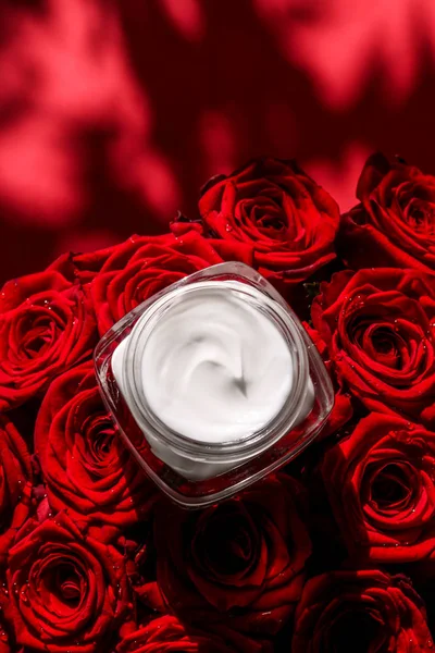 Moisturizing beauty face cream for sensitive skin and red roses