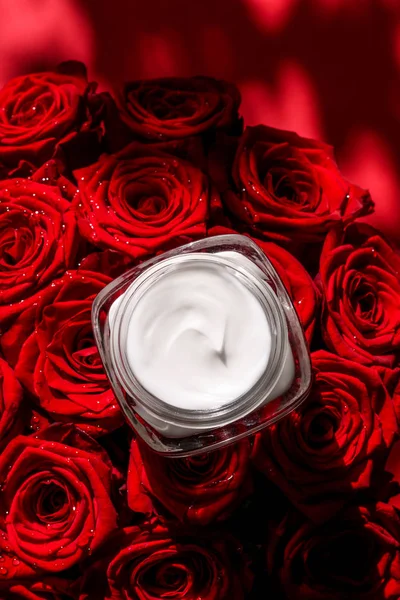 Moisturizing beauty face cream for sensitive skin and red roses