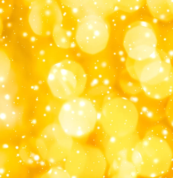 Glamoröst guld glänsande glöd och glitter, lyx semester bakgrund — Stockfoto