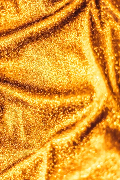 Golden holiday sparkling glitter abstract background, luxury shi
