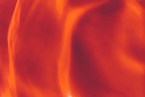 Оранжевый фон, фактура огненного пламени и волна. — стоковое фото