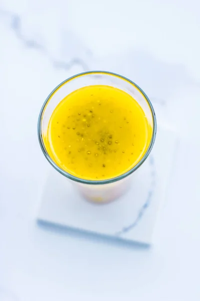 Glass of yellow fruit smoothie juice with chia seeds for diet de — Stock Photo, Image