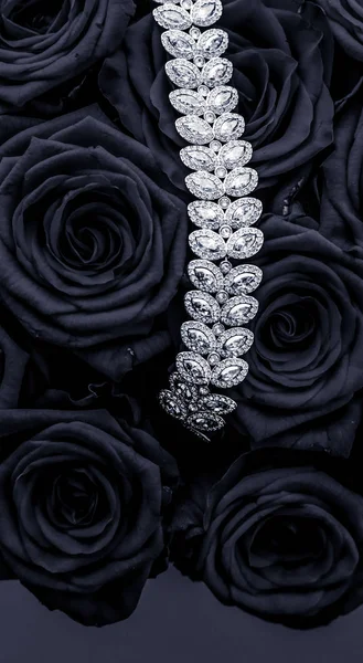 Luxury diamond jewelry bracelet and black roses flowers, love gi