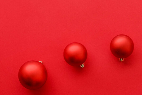 Christmas baubles on red flatlay backdrop, luxury winter holiday