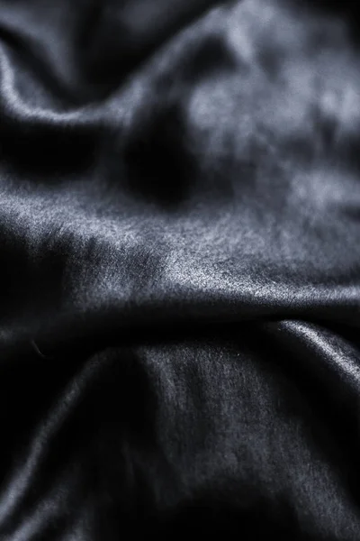 Lujo negro suave seda flatlay fondo textura, vacaciones glamo — Foto de Stock