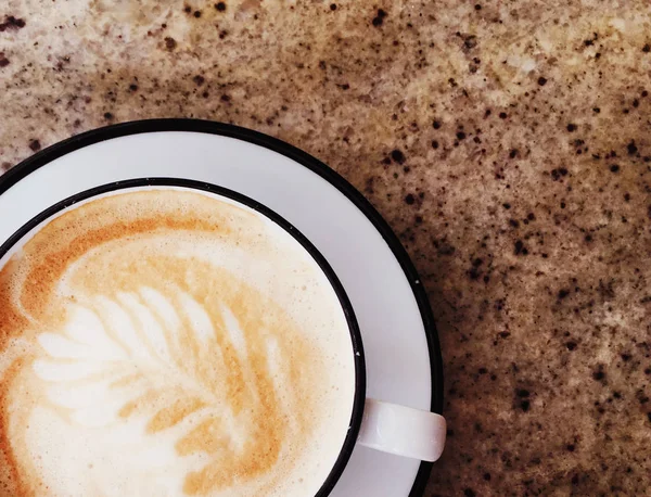 Cappuccino for breakfast in cafeteria, coffee cup on table in pa — Stock Photo, Image