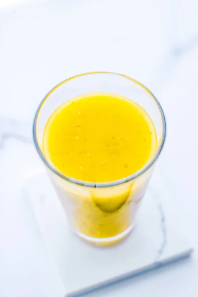 Glass of yellow fruit smoothie juice with chia seeds for diet de — Stock Photo, Image