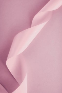 Pembe arka planda soyut ipek kurdele, özel lüks. 