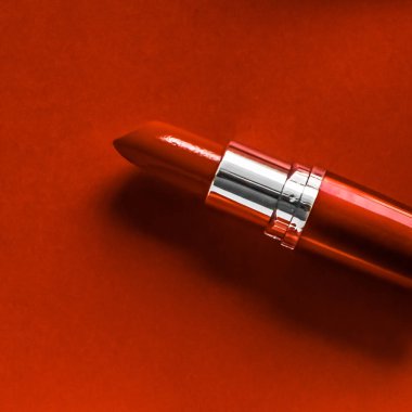 Turuncu tatil arka planında lüks ruj ve ipek kurdele, anne.