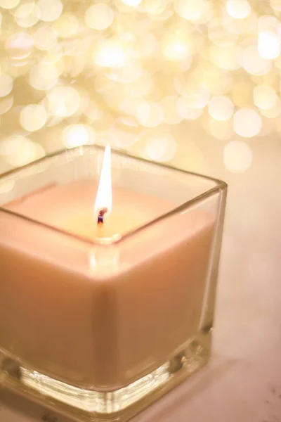 Aromatic candle on golden Christmas and New Years glitter backgr — Stock Photo, Image