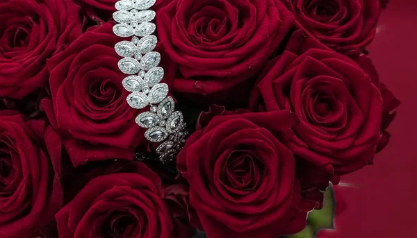 Luxury diamond jewelry bracelet and red roses flowers, love gift