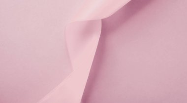 Pembe arka planda soyut ipek kurdele, özel lüks. 