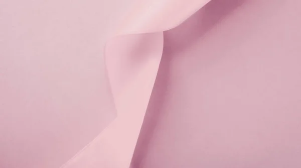 Abstract silk ribbon on blush pink background, exclusive luxury