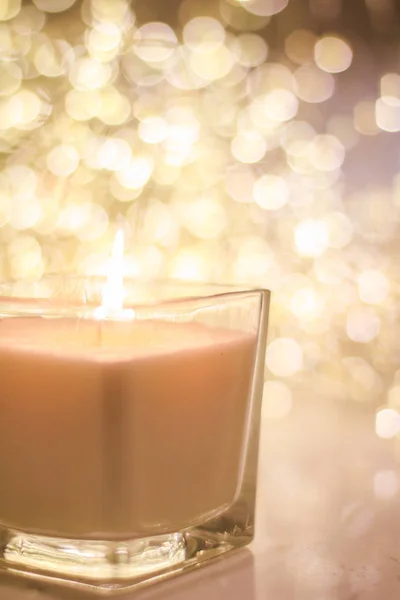 Aromatic candle on golden Christmas and New Years glitter backgr — Stock Photo, Image