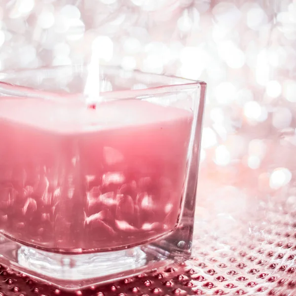 Rose aromatic candle on Christmas and New Years glitter backgrou — Stock Photo, Image