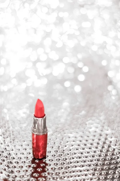 Coral lipstick on silver Christmas, New Years and Valentines Day