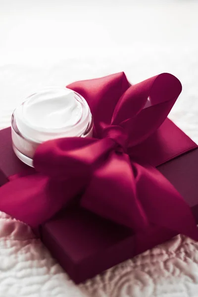 Luxury face cream for sensitive skin and maroon holiday gift box