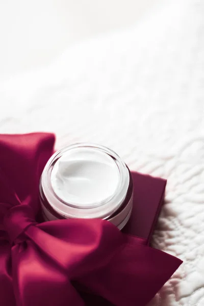 Luxury face cream for sensitive skin and maroon holiday gift box