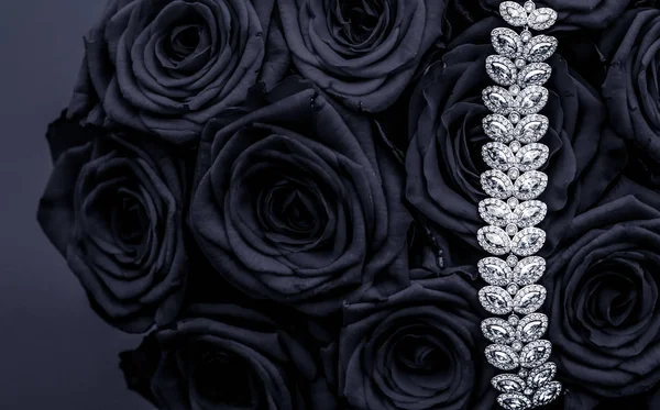 Luxury diamond jewelry bracelet and black roses flowers, love gi