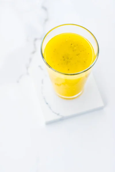 Glass of yellow fruit smoothie juice with chia seeds for diet de — Stock Photo, Image