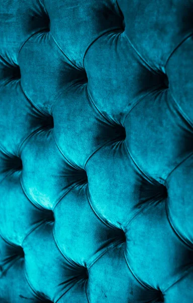 Blue luxury velour quilted sofa upholstery with buttons, elegant — Stock Photo, Image