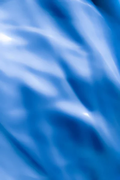 Blaue abstrakte Kunst Hintergrund, Seide Textur und Wellenlinien in mot — Stockfoto