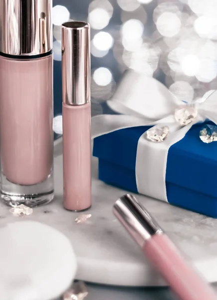 Holiday make-up foundation base, concealer and blue gift box, lu