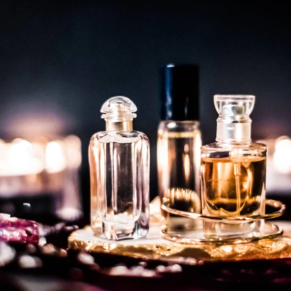 Perfume bottles and vintage fragrance at night, aroma scent, fra — Stock Photo, Image