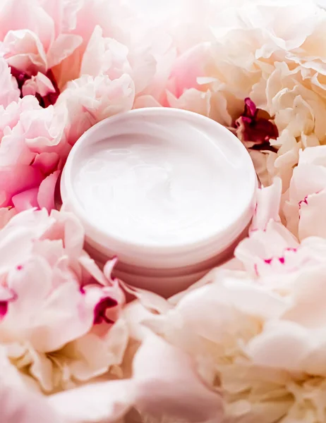 Luxe cosmetic cream jar as antiaging skincare routine product on background of peony flowers, body moisturizer and beauty branding